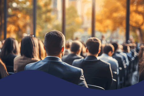 Business people sitting as an audience at a business convention